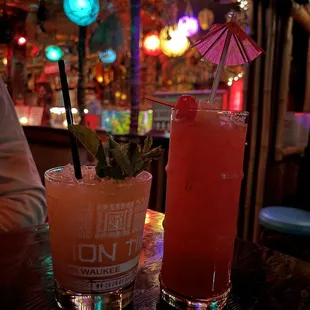 two cocktails on a table