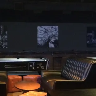 two leather chairs and a pool table