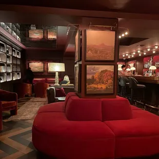 a red couch in a dimly lit room