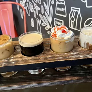This month&apos;s flight: Cinnamon Oat Latte, Nitro Coffee, Strawberry Shortcake &amp; Banana Cream Cold Brew!