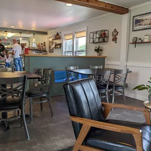 a woman standing in a coffeehouse