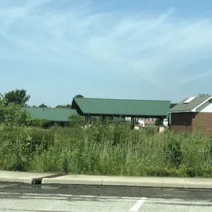 Far view of covered picnic and restrooms