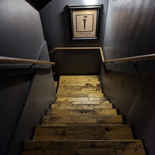 a staircase leading to a clock