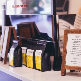 a coffee shop counter with a menu on it