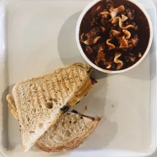 a plate with a sandwich and a bowl of soup