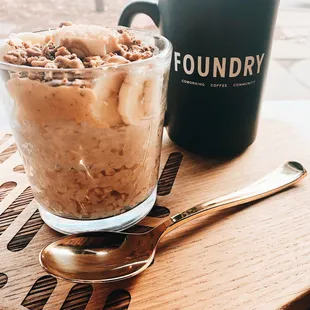 a cup of coffee and a bowl of cereal