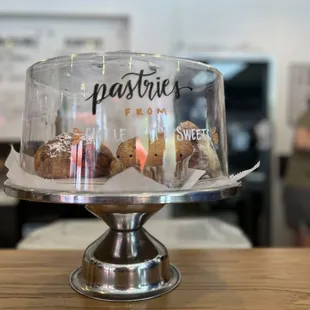 a cake with pastries on it