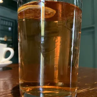 a glass of tea on a table