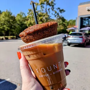 Iced pumpkin spice latte with oat milk and an apple cider donut