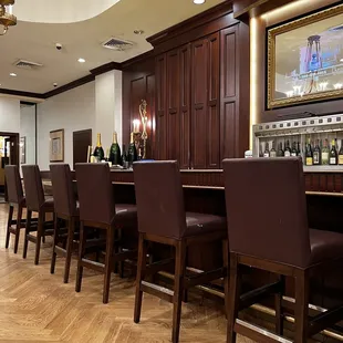 a bar with wine bottles on it
