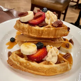 Pecan waffle with pecans, fruit, and fluffy marscapone