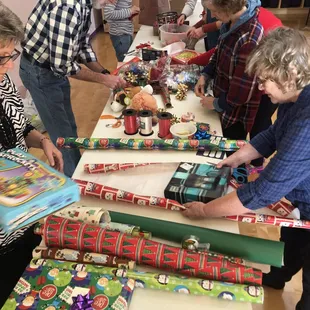 Studio comes together to wrap presents for homeless children