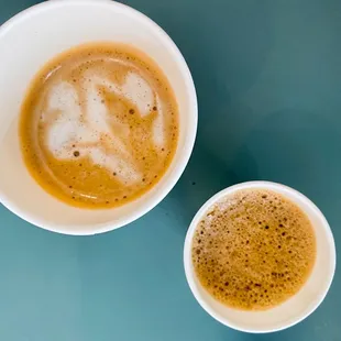The coffee on the left is a latte and the one on the right was a Cuban