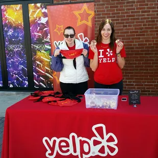 These ladies are rockin' the Yelp fanny packs &amp; snacks booth!