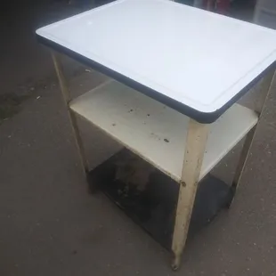 1950's ceramic table. Top is beautiful. The rest could use some paint. Wheels work great. $40 obo.