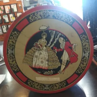 30's or 40's fruit cake tin. Can ship (you pay shipping) $20 obo. It has a few flaws, would be a great addition to anyone's collection.