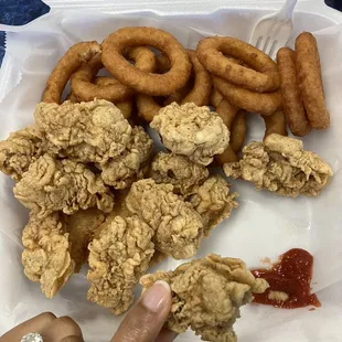 12 oysters and 2 sides (both onion rings) for $15.99. Single piece of catfish/basa fish on its own for $1.99. Good prices. Hard to beat.