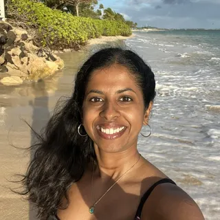 Sandhya G.