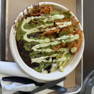 Four brothers with chicken black beans plantation white rice avocados and cilantro sauce