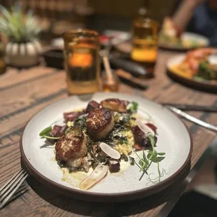 Sea scallops, sliced radishes, cheesy risotto and pork belly