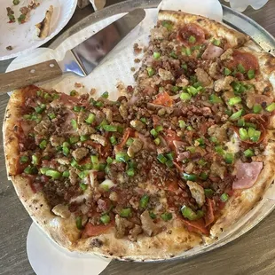 Our all meat pizza with added green peppers.