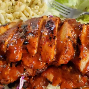 a plate of chicken and macaroni salad