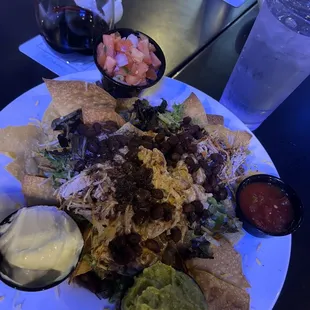 Nacho Grande with shredded chicken and guacamole