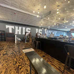 a bar with a sign that says this is here