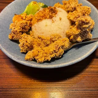 Popcorn chicken over rice