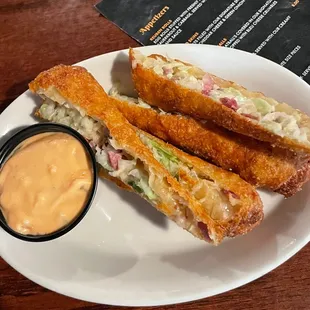 a sandwich and dipping sauce