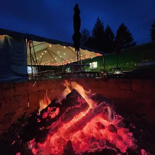 Campfire, tent seating, food truck