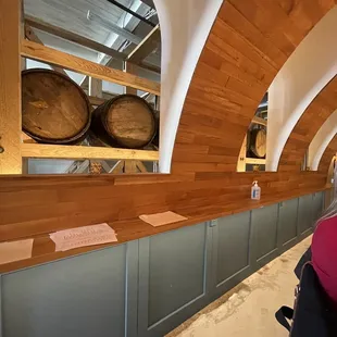 a woman in a wine cellar