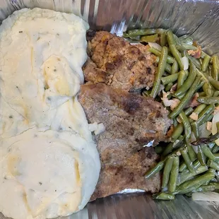Pork tenderloin with charred pineapple/pepper salsa, sour cream/chive mashed potatoes and garlic green beans.