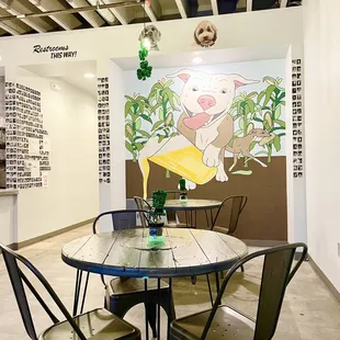 a round table with four chairs