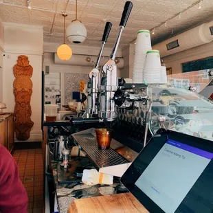 a man working at a coffee shop
