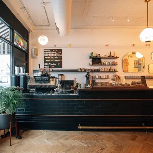 a coffee shop with a black counter