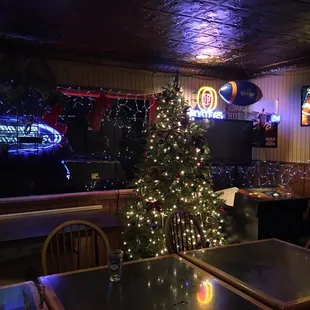 a christmas tree and neon signs