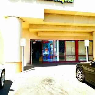 a car parked in front of the store