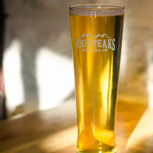 a glass of beer on a table