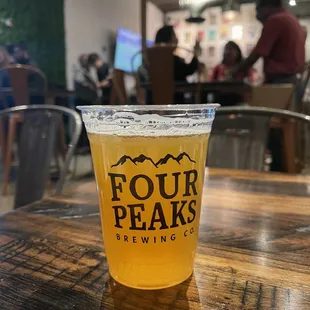 a pint of four peaks brewing