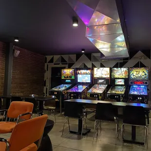 a row of pinball machines