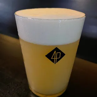 a glass of beer on a table