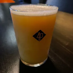 a glass of beer on a table