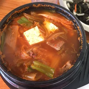 My sons had Kimchi Soup, yes he is a kid and loves this soup, and he love it with big cuts of tofu and beef in it.