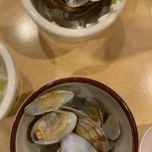 a bowl of clams and a bowl of soup