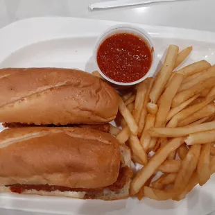 two sub sandwiches and french fries