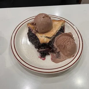 Warm blueberry pie with chocolate ice cream