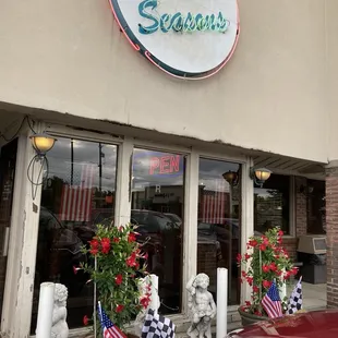 Front entrance with race &amp; American flags for Memorial Day.