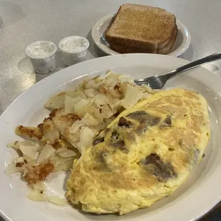 Gyro and feta omelette with wheat toast and fried potatoes