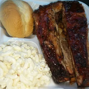Combo 3 piece ribs meal. Macaroni salad, ribs, dinner roll and mojos that you can&apos;t reallt see because it was  hidden beneath the ribs.